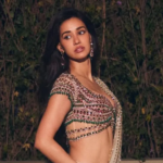 Disha Patani’s ivory pre-draped sari is teamed with a bejewelled blouse with 8,000 gemstones